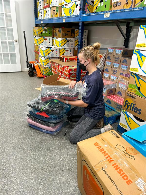 girl packing blankets
